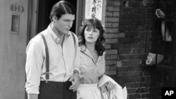 FILE - Christopher Reeve and Margot Kidder (R) appear during the filming of "Superman" in New York's Lower East Side, July 8, 1977. 