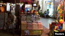 A vendor, front, awaits customers for an excursion trip at the Red Sea resort of Sharm el-Sheikh, Nov. 8, 2015. 