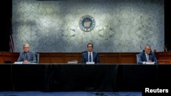 U.S. Senate Majority Leader Mitch McConnell, and U.S. Senate Minority Leader Chuck Schumer meet with Treasury Secretary Steve Mnuchin (C) to work on coronavirus economic aid legislation, on Capitol Hill, in Washington, March 20, 2020.
