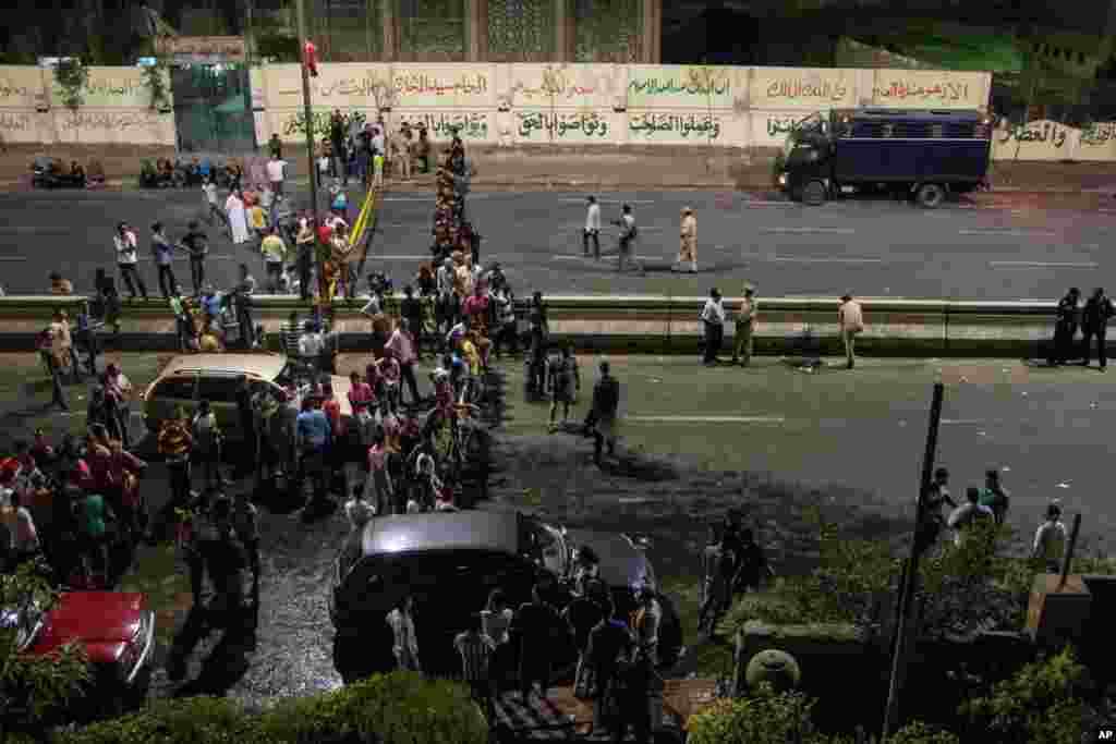 Egyptians gather outside of a national security building after a bomb exploded in the Shubra el-Kheima neighborhood of Cairo injuring several people according to security officials, early&nbsp; Aug. 20, 2015.