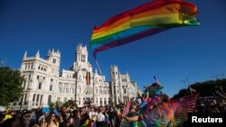Revelers attend the World Pride parade in Madrid, Spain, July 1, 2017. 