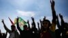 FILE - Supporters of pro-Kurdish Peoples' Equality and Democracy Party (DEM Party) chant slogans during the Newroz celebrations, in Istanbul, Turkey, on March 17, 2024. 