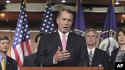 House Speaker John Boehner of Ohio, gestures during a news conference on Capitol Hill in Washington, Monday, Aug. 1, 2011.