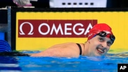 Katie Ledecky smiles after winning the women's 200-meter freestyle final at the U.S. Olympic swimming trials in Omaha, Neb., Wednesday, June 29, 2016.