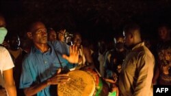 FILE - Supporters of Malian politician Soumaila Cisse celebrate in front of his house in Bamako, Mali, on Oct. 8, 2020, after hearing the news that he landed at the Bamako airport after having been freed from captivity.