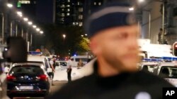 Police secure a scene in downtown Brussels after a reported knife attack on Belgian Army soldiers, Aug. 25, 2017.