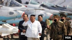 In this undated file photo provided by the North Korean government on April 12, 2020, North Korean leader Kim Jong Un inspects an air defense unit in western area. (Korean Central News Agency/Korea News Service via AP, File)