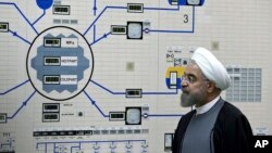 FILE - Iran's President Hassan Rouhani is seen during a visit to the Bushehr nuclear power plant in southern Iran, Jan. 13, 2015. 