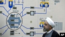 FILE - Iran's President Hassan Rouhani visits the Bushehr nuclear power plant, Jan. 13, 2015. 