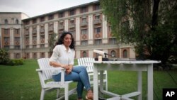FILE - Raha Moharrak, the first Saudi Arabian woman to scale the world's highest peak Mount Everest, talks to the media at Yak and Yeti Hotel in Katmandu, Nepal, May 21, 2013.
