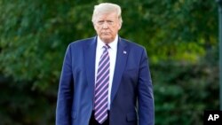 President Donald Trump walks from the Oval Office to speak to reporters on the South Lawn of the White House, Tuesday, Sept. 22, 2020, before leaving for a short trip to Andrews Air Force Base, Md., and then onto Pittsburgh for a campaign rally. (AP…