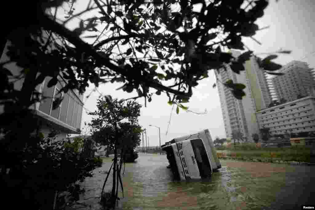 A truck is seen turned over as Hurricane Irma passes south Florida, in Miami, Sept. 10, 2017.