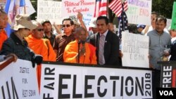 រូបឯកសារ៖ ព្រះសង្ឃមកពីវត្ត​មុនីសុតារាម នៅរដ្ឋ​មីនីសូតា ​សហរដ្ឋ​អាមេរិក មក​ជួបជុំ​គ្នា​ធ្វើ​បាតុកម្ម​តវ៉ា​ឲ្យ​មាន​ការ​គោរព​សិទ្ធិមនុស្ស និង​លិទ្ធិ​ប្រជាធិបតេយ្យ​នៅ​កម្ពុជា និង​ការ​ដោះលែង​លោក កឹម សុខា នៅ​មុខ​ក្រសួង​ការបរទេស រដ្ឋធានី​វ៉ាស៊ីនតោន កាលពី​ថ្ងៃទី១៥ ខែកញ្ញា ឆ្នាំ២០១៧។