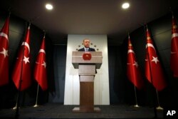 Turkey's President Recep Tayyip Erdogan delivers a statement on national television from his official residence in Istanbul, June 24, 2018.