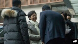 Hong Kong Chief Executive Carrie Lam is greeted as she arrives at a hotel in Beijing, Dec. 14, 2019.