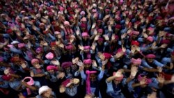 School girls wearing pink turban wave during celebrations to mark International Day of the Girl Child 2018, at a school in Chandigarh, India October 11, 2018.