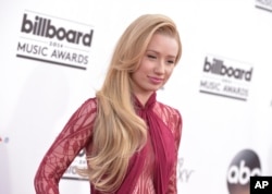 Iggy Azalea arrives at the Billboard Music Awards at the MGM Grand Garden Arena, May 18, 2014, in Las Vegas.