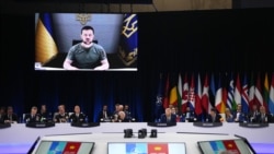 President of Ukraine Volodymyr Zelenskyy (on screen) during a video address at the NATO summit in Madrid, Spain, on June 29, 2022. (Manu Fernandez/Associated Press)