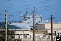 FS Mistral, a French amphibious assault ship, pulls into port at Naval Base Guam, May 11, 2017, near Hagatna, Guam. Troops from the United States, Japan, France and the United Kingdom are gathering for drills they say will show support for the free passage in the South China Sea.