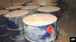 FILE - In this imaged released by the US military, hundreds of gallons are seen of various chemicals found in containers at the site of a suspected insurgent facility in northern Iraq. 