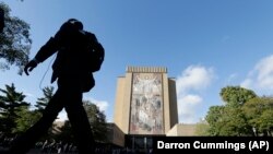A double rainbow forms as people gather outside Buckingham Palace, following a statement from the Palace over concerns for Britain's Queen Elizabeth's health, in London, Britain. The Palace later announced the Queen's death.