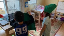 Emma Paik, with her younger brother, celebrates her eighth birthday with an online party in the Los Angeles area. (Photo courtesy Nan Paik)