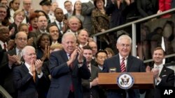 Secretary of State Rex Tillerson, center right, accompanied by State Department Undersecretary for Political Affairs Tom Shannon, center left, pauses while speaking to State Department employees upon arrival at the State Department in Washington, Feb. 2, 