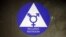 FILE - A sticker designates a gender neutral bathroom at Nathan Hale high school in Seattle, May 17, 2016.