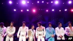Elvis tribute artists line up before the winners are announced during the "Images of the King: Las Vegas" tribute artist contest in Las Vegas, July 16, 2017. 