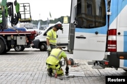 Security measures are taken near the presidential palace ahead of the meeting between U.S. President Donald Trump and Russian President Vladimir Putin in Helsinki, Finland, July 12, 2018.