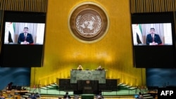 This UN handout photo shows Sheikh Abdullah bin Zayed Al Nahyan, on screens, Minister for Foreign Affairs and International Cooperation of the United Arab Emirates, virtually addressing the general debate of the United Nations in New York, Sept. 29, 2020.