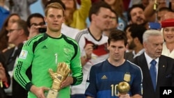 Germany's goalkeeper Manuel Neuer winner of the golden glove award for best goalkeeper stands alongside golden ball winner Argentina's Lionel Messi after the World Cup final soccer match between Germany and Argentina in Rio de Janeiro, Brazil, July 13, 20
