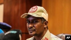 FILE - In this April 30, 2019 file photo, Sudanese Gen. Mohamed Hamdan Dagalo, the deputy head of the military council speaks at a press conference in Khartoum, Sudan.