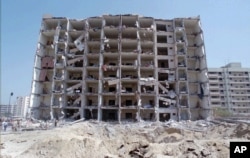 FILE - A June 30, 1996, photo shows a general view of the destroyed Khobar Towers in Dhahran, Saudi Arabia.