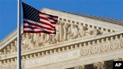FILE - An American flag flies in front of the Supreme Court in Washington, June 27, 2012.