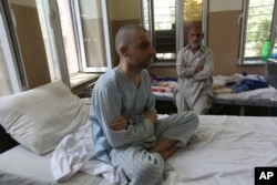 FILE - Patients are treated in the Mental Health and Drug Addicts' Hospital in Kabul, Afghanistan, July 17, 2016. After almost 40 years of conflict and crisis, experts say the vast majority of the Afghan population suffers from some form of post-traumatic stress disorder.