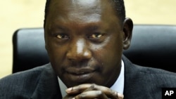Congolese warlord Thomas Lubanga awaits his sentence in the courtroom of the International Criminal Court in The Hague, July 10, 2012.