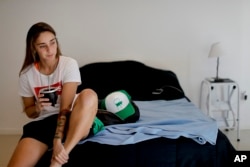 Soccer player Macarena Sanchez drinks "mate" at her home in Buenos Aires, Argentina.