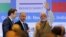FILE - India's Prime Minister Narendra Modi waves as Russian President Vladimir Putin looks on after attending the India-Russia Business Summit in New Delhi, India, Oct. 5, 2018. 