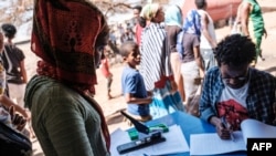 An Eritrean refugee woman is registered at Mai Aini Refugee camp, in Ethiopia, Jan. 30, 2021. 