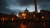 People walk in Saint Peter's Square at the Vatican, March 7, 2013.