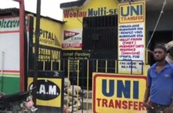 A money transfer business is shuttered in protest of new regulation, in Port au Prince, Haiti. (Matiado Vilme/VOA)