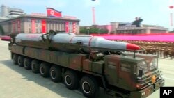 A military truck carrying a missile parades during a ceremony marking the 60th anniversary of the Korean War armistice in Pyongyang, North Korea, July 27, 2013.