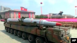 FILE - A military truck carrying a missile parades during a ceremony marking the 60th anniversary of the Korean War armistice in Pyongyang, North Korea, July 27, 2013.