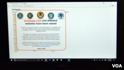 A screen shot of the website Backpage.com with an FBI seisure notice is seen on a laptop, April 7, 2018. (Photo: Diaa Bekheet/VOA)