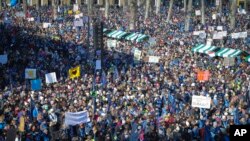 FILE - Thousands gather during a trade unions rally in downtown Ljubljana, Slovenia, Feb. 14, 2018. 