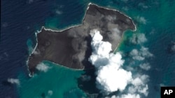 FILE - This satellite image provided by Maxar Technologies shows an overview of Hunga Tonga Hunga Ha'apai volcano in Tonga on Jan. 6, 2022, before a huge undersea volcanic eruption.
