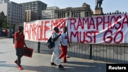 Members of the political party Economic Freedom Fighters (EFF) gather at Church Square after calling for a "National Shutdown" and demanding that President Cyril Ramaphosa resigns in Pretoria, South Africa March 20, 2023. 