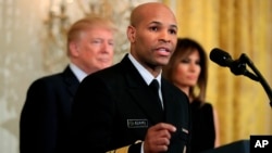 FILE - Surgeon General Jerome Adams speaks at the White House in Washington, Feb. 13, 2018. Adams is expected to speak about a public health advisory regarding an opioid overdose antedote Thursday at the National Rx Drug Abuse & Heroin Summit in Atlanta.