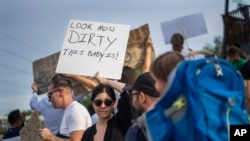 Residents of the Blairgowrie neighborhood of Johannesburg, South Africa, demonstrate against the lack of water, March 12, 2024.